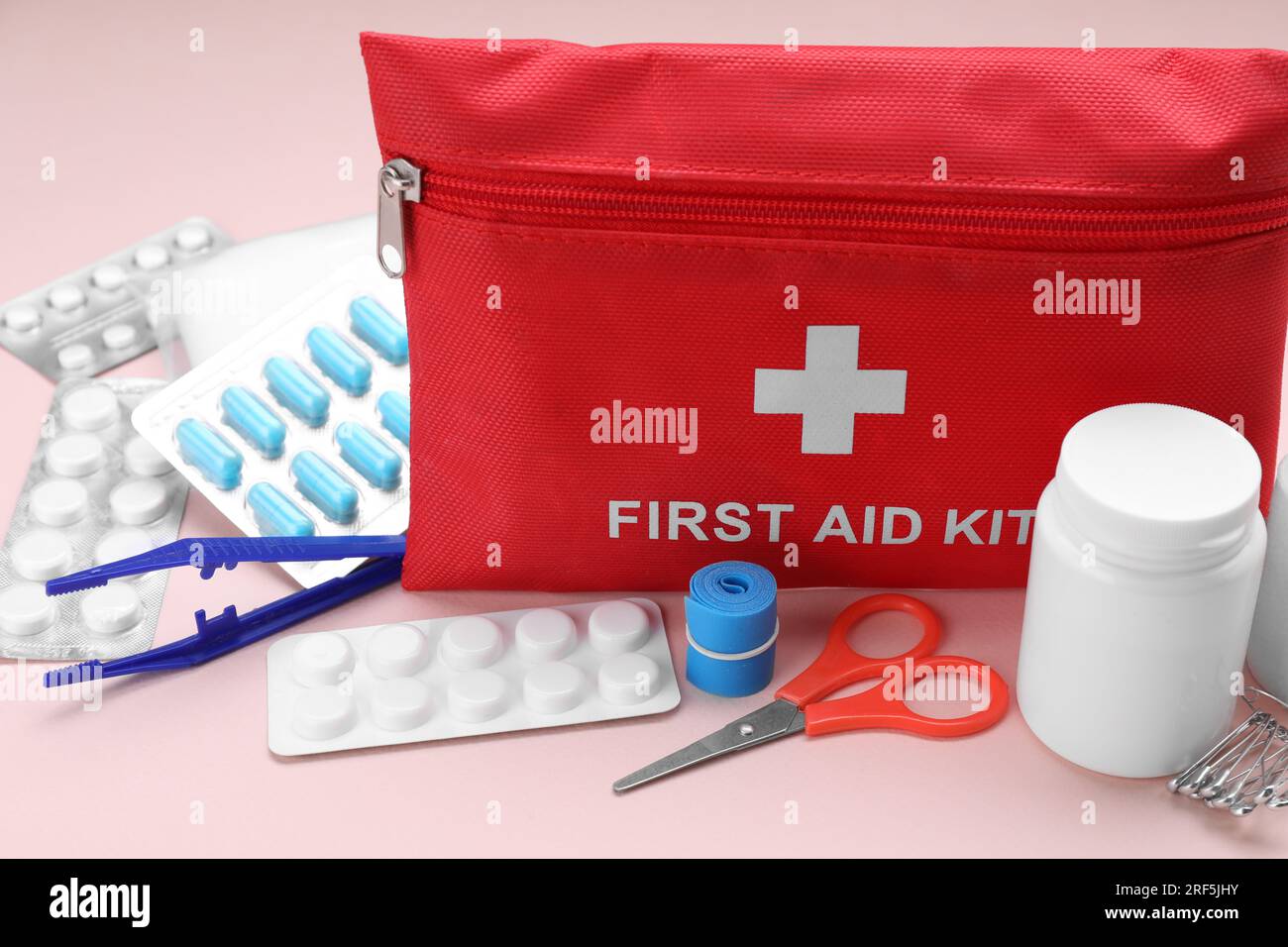 First aid kit on pink background, closeup Stock Photo - Alamy