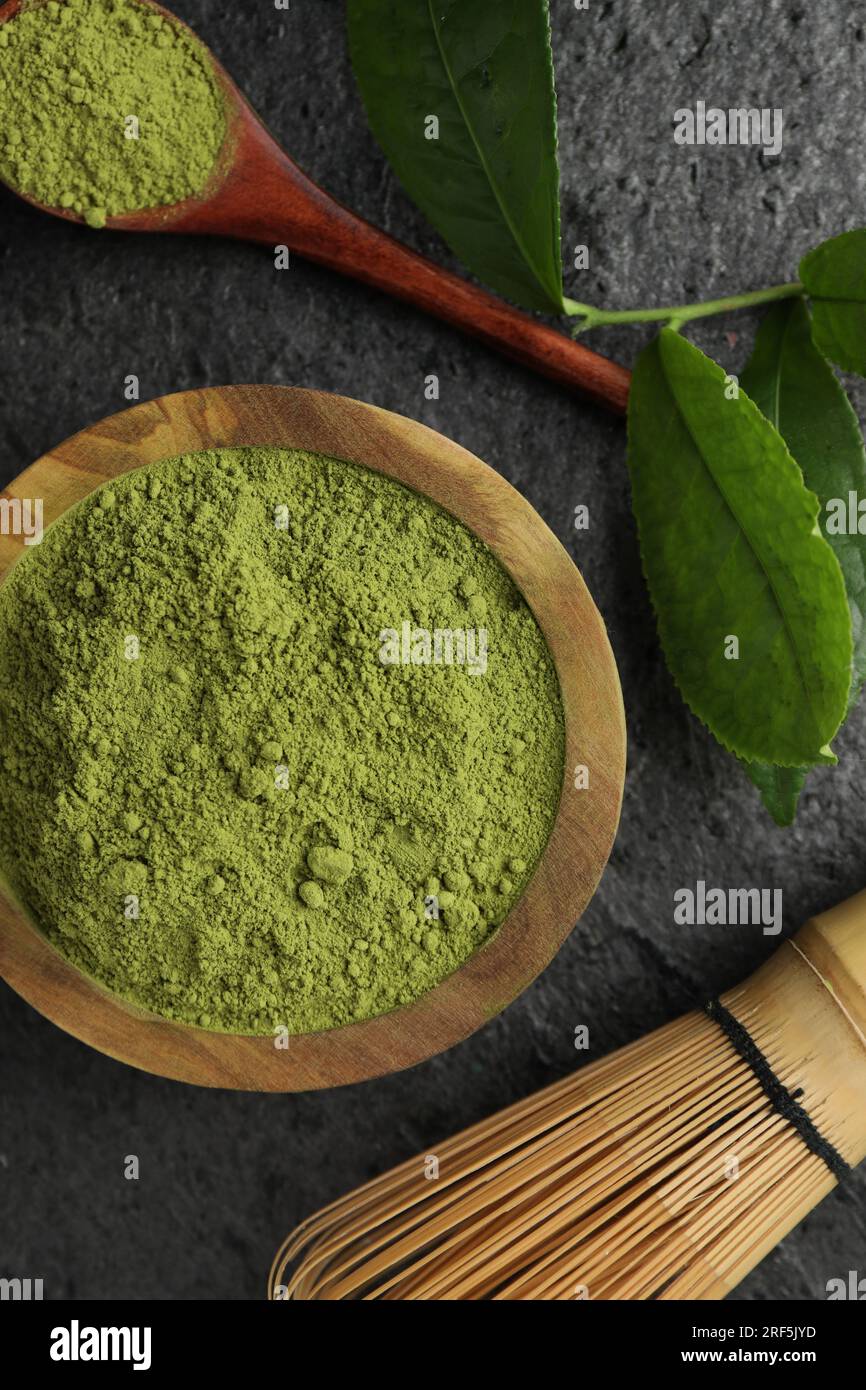 Flat lay composition with green matcha powder on grey table Stock Photo