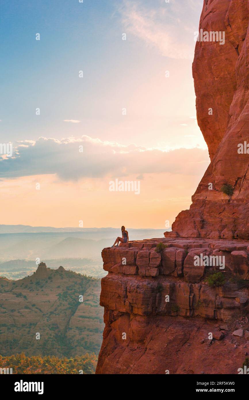 Little girl on the edge of a cliff at Cathedral Rock in Sedona, Arizona ...