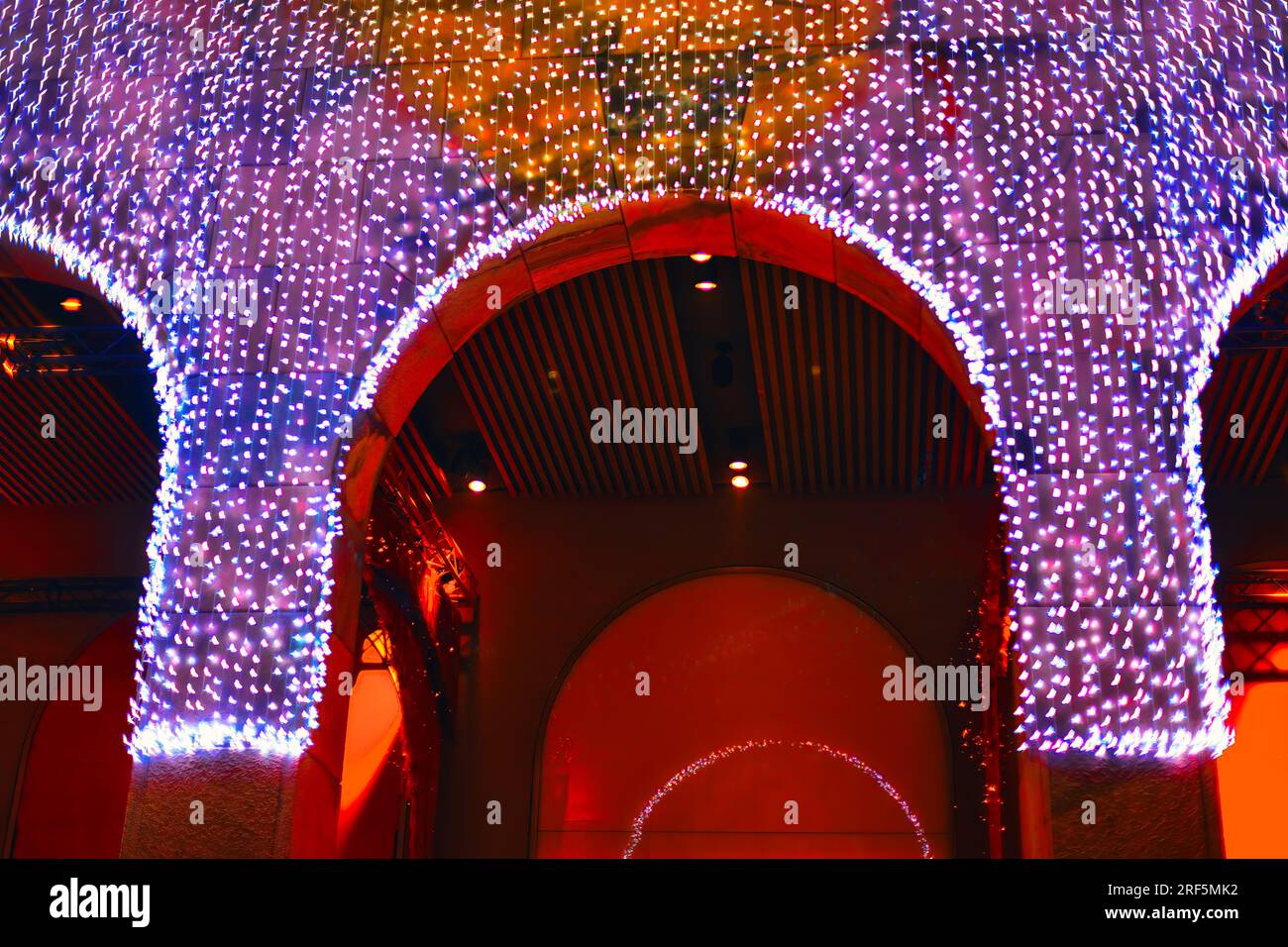 Garlands on the architecture arches . Christmas lights in the interior ...
