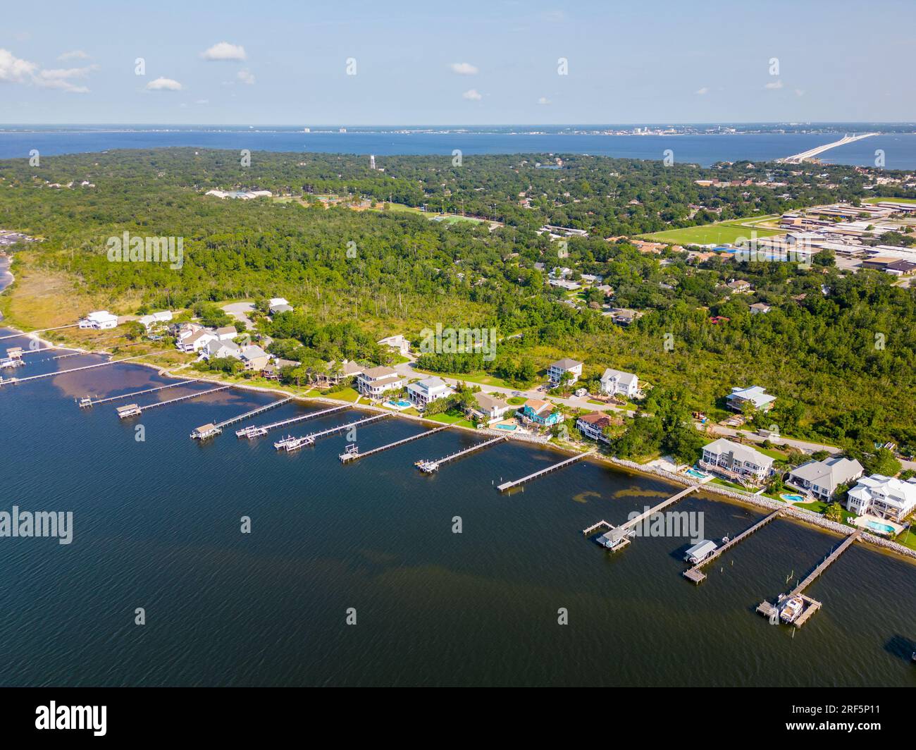 Aerial photo luxury waterfront homes with dock Gulf Breeze Florida USA