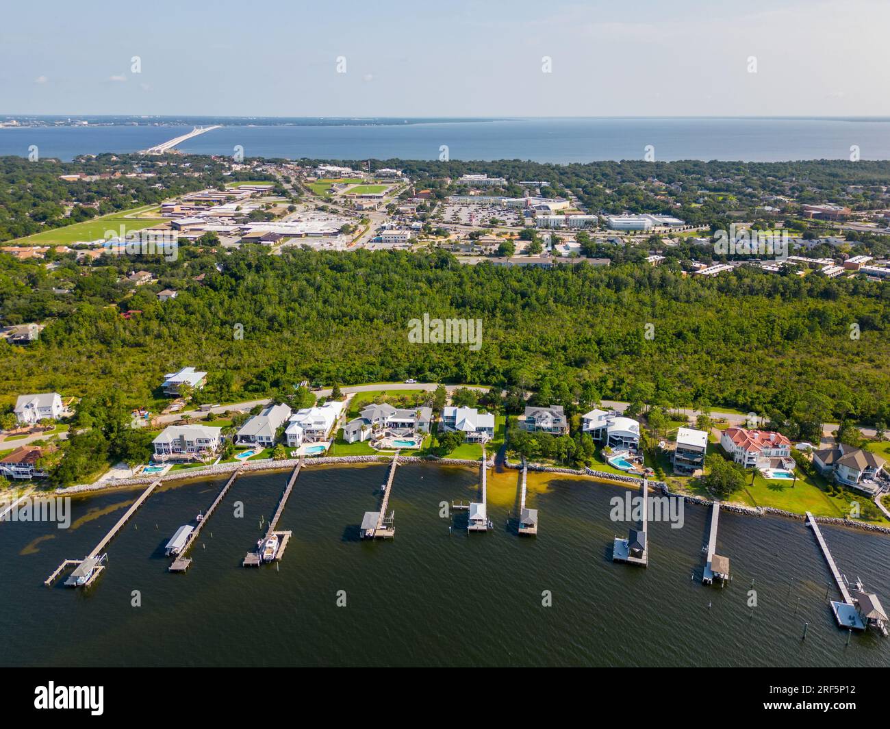 Aerial photo luxury waterfront homes with dock Gulf Breeze Florida USA