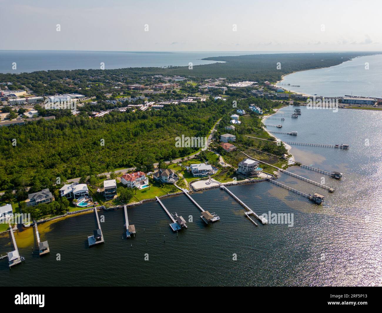 Aerial photo luxury waterfront homes with dock Gulf Breeze Florida USA