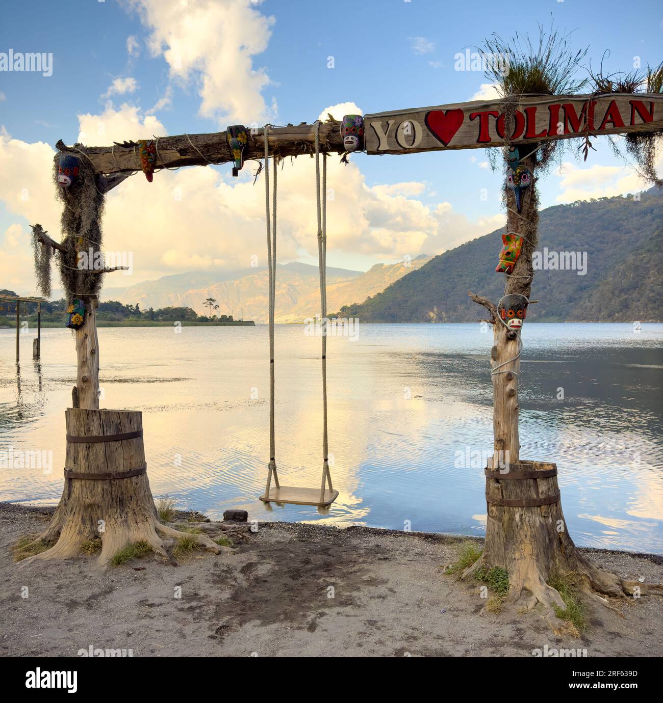 Swings on the shore of San Lucas Toliman a town on Lake Atitlan in Guatemala Stock Photo