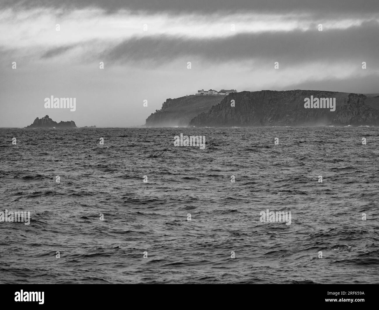 B&W, Lands End, (viewed form English Channel, Scillonian 3) Headland, Landmark, Cornwall, England, UK, GB. Stock Photo