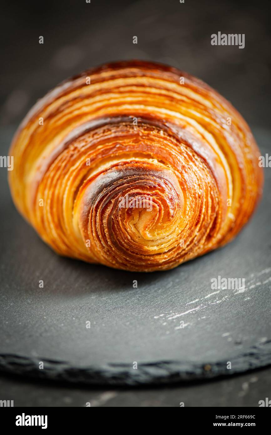 Detailed close-up of crispy, flaky, and delicious butter croissant Stock Photo