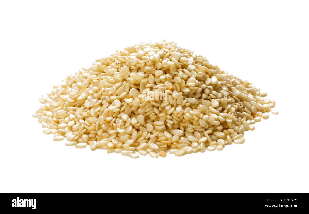 Heap of dried sesame seeds isolated on white background, Sesamum Indicum. Stock Photo