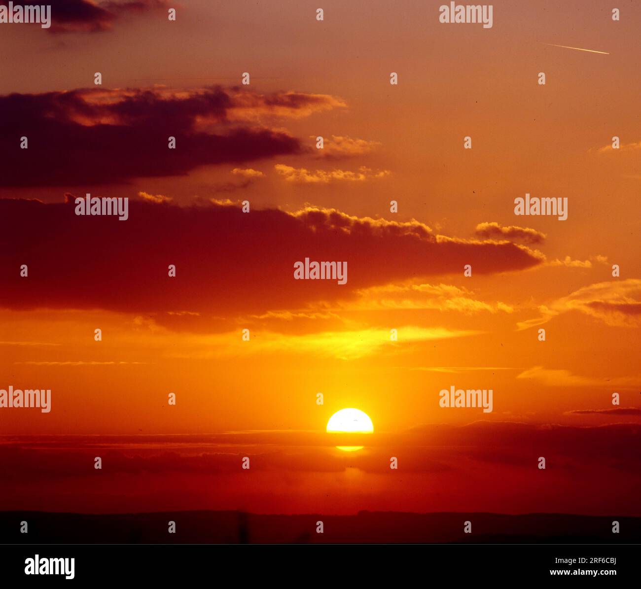 Sunset in the evening sky, cloudy atmosphere Stock Photo