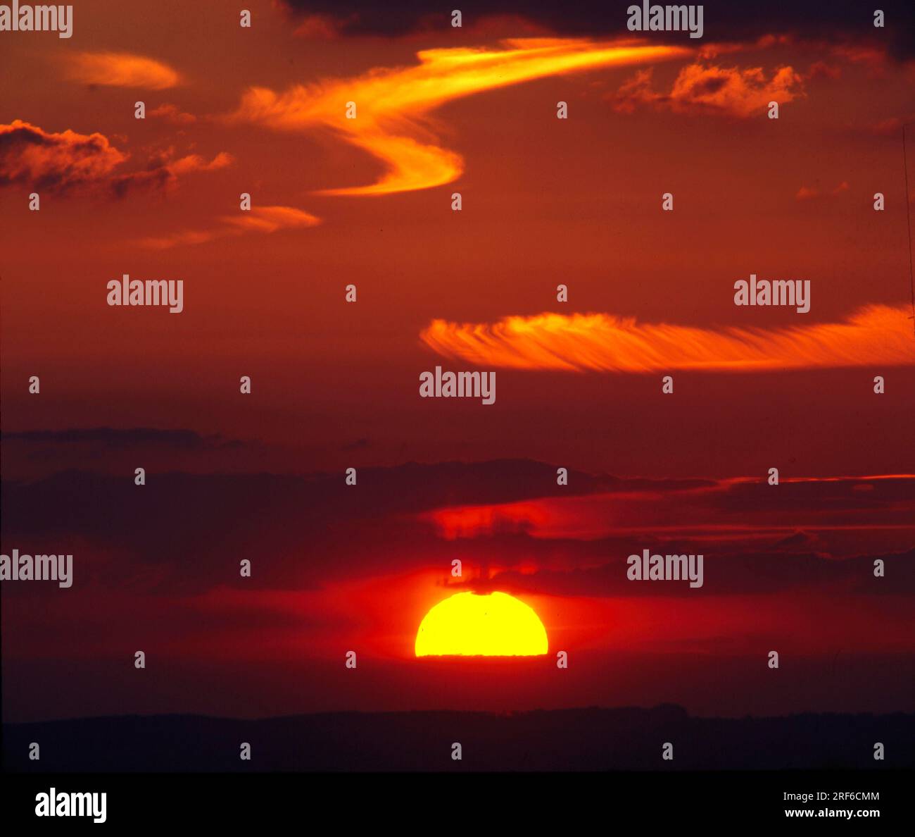 Sunset in the evening sky, cloudy atmosphere Stock Photo