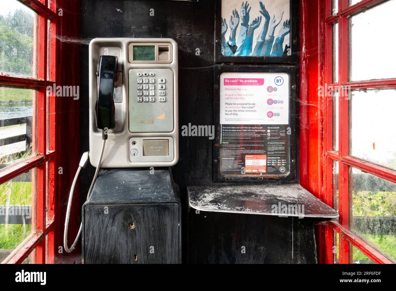 BT payphone red telephone box interior - Gairlochy, Scottish Highlands, Scotland, UK Stock Photo