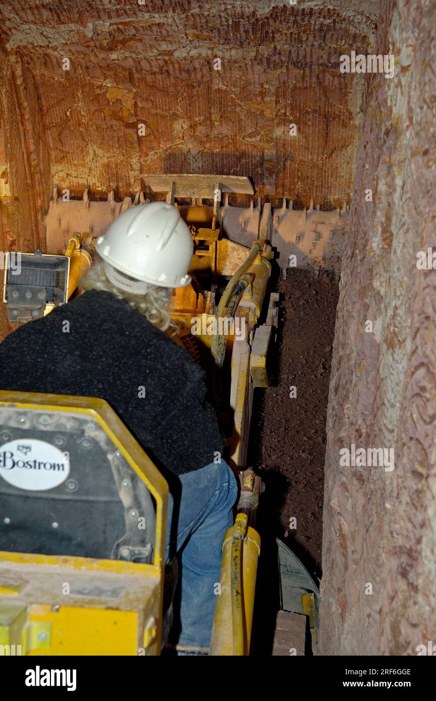 Worker with shaft machine in opal mine, mine, Coober Pedy, South ...