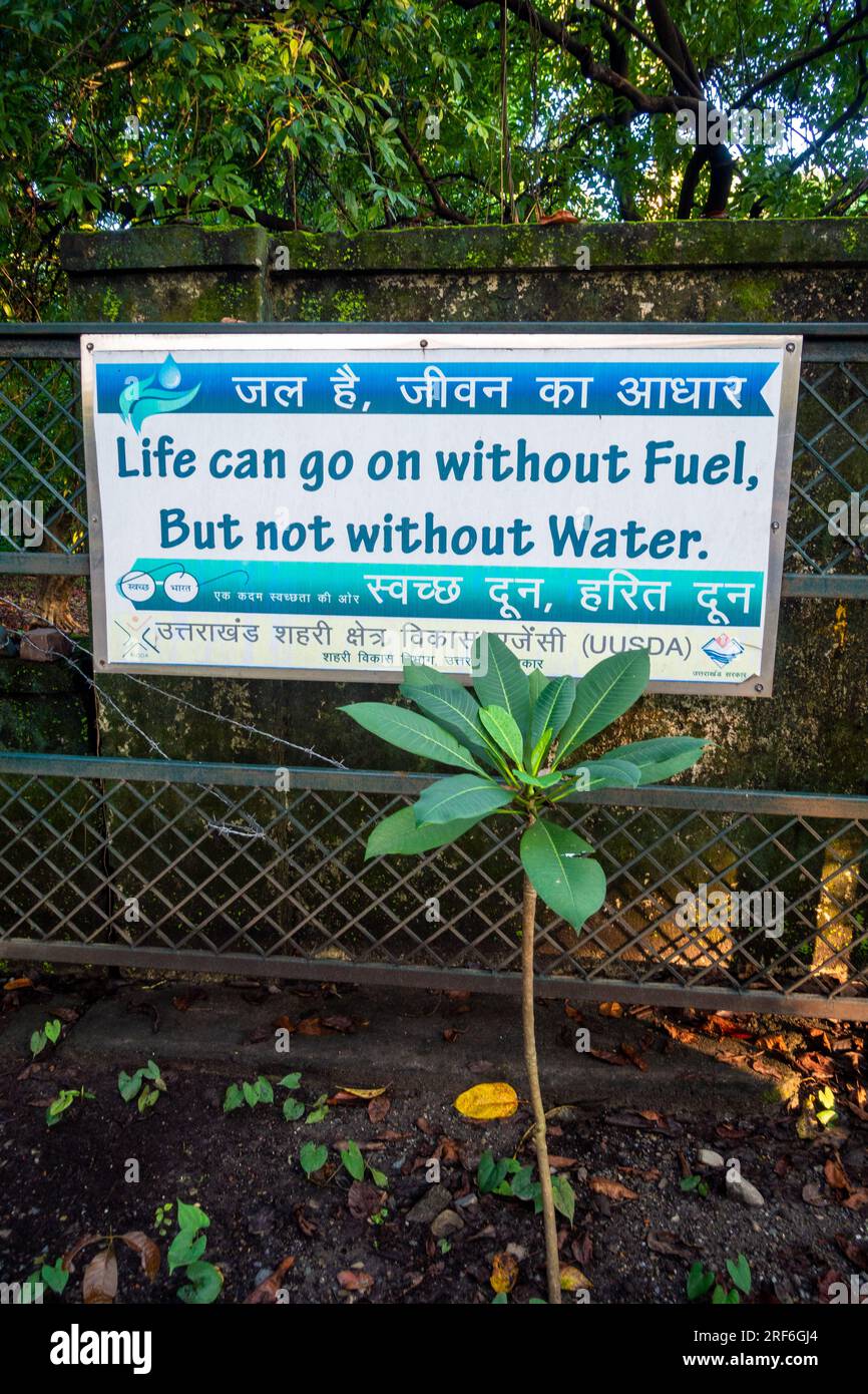 June 28th 2023.Dehradun city, Uttarakhand India. Green Garden Signboard: 'Conserve Water, Embrace Eco-Friendly Practices' with inspiring quotes. Stock Photo