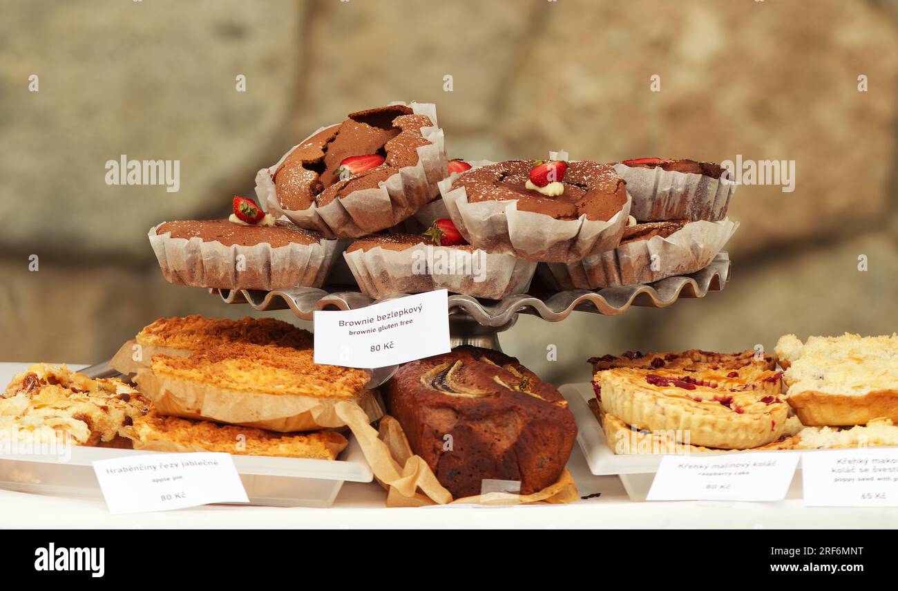Gluten-free brownies with strawberries and other fruit cakes and pastries at a bakery stall at the Naplavka street market in downtown Prague. Stock Photo