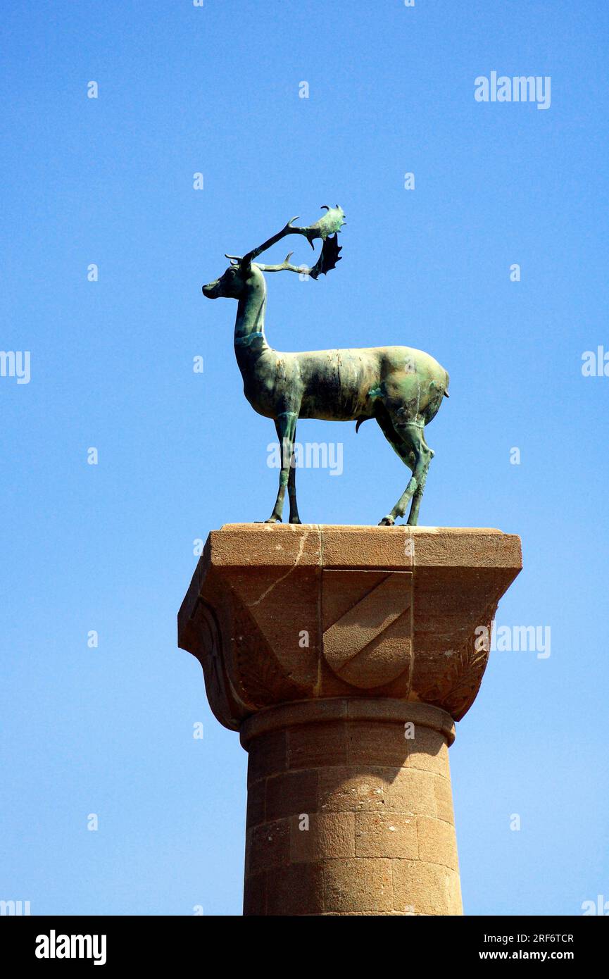 Deer sculpture on column, Mandraki harbour, Rhodes town, Rhodes, Greece Stock Photo