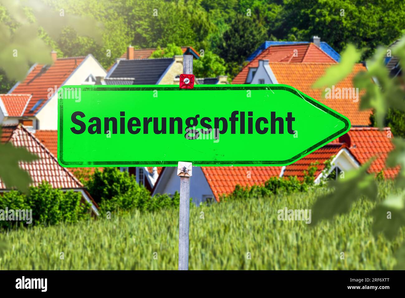 FOTOMONTAGE, Wegweiser mit Aufschrift Sanierungspflicht Stock Photo