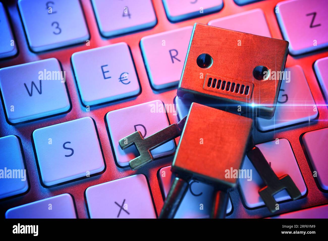 Roboterfigur auf einer Computertastatur, Symbolfoto Künstliche Intelligenz Stock Photo