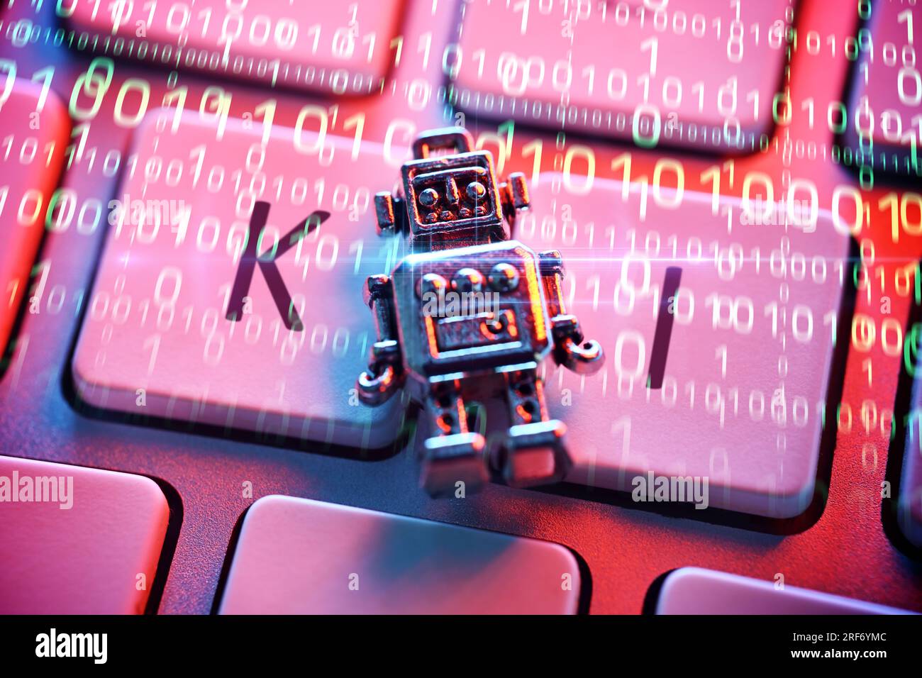 FOTOMONTAGE, Roboterfigur auf einer Computertastatur mit Aufschrift KI, Symbolfoto Künstliche Intelligenz Stock Photo