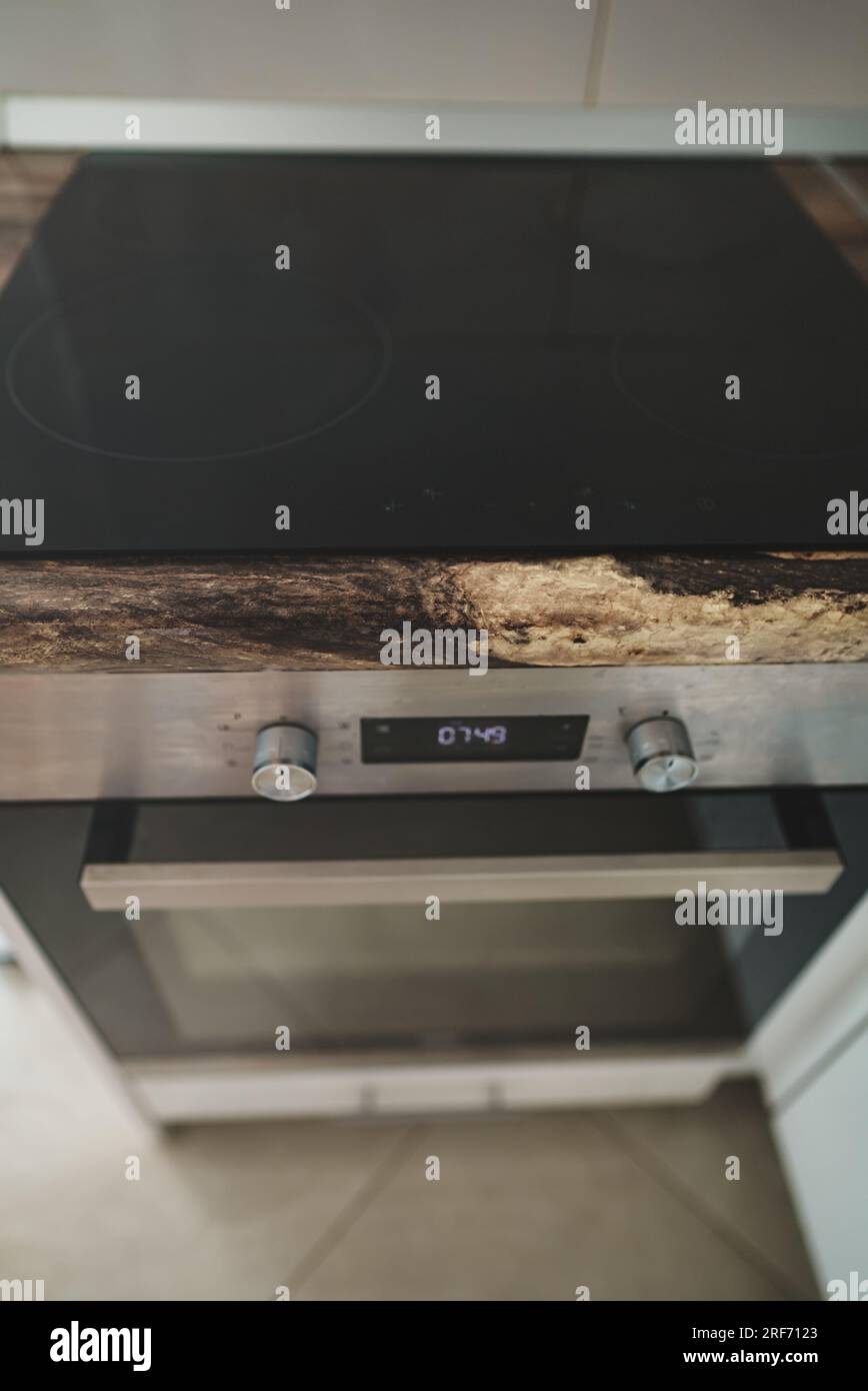 Modern electric stove with induction cooktop Stock Photo - Alamy