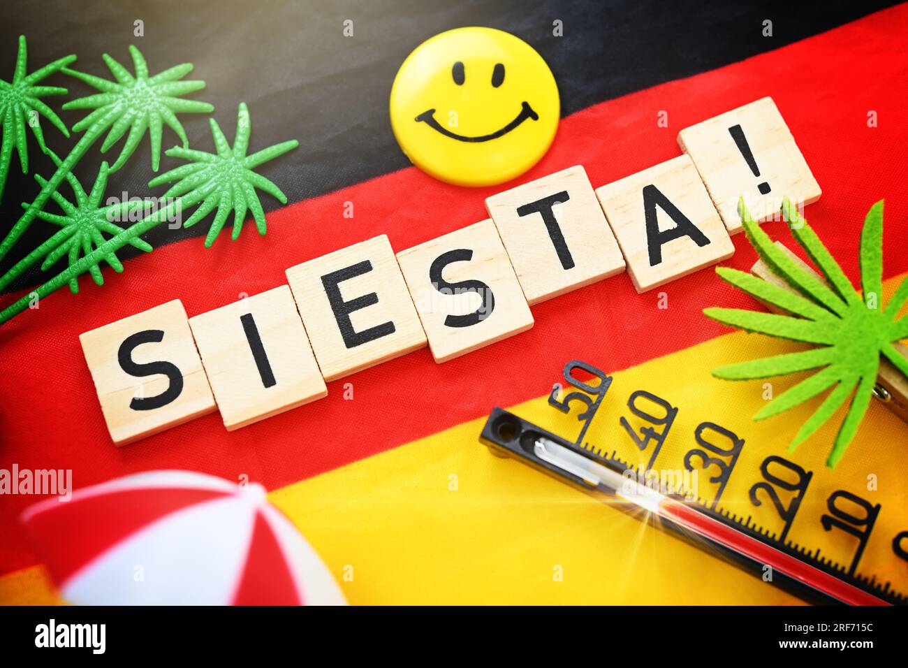 Schriftzug Siesta! auf einer Deutschlandfahne Stock Photo
