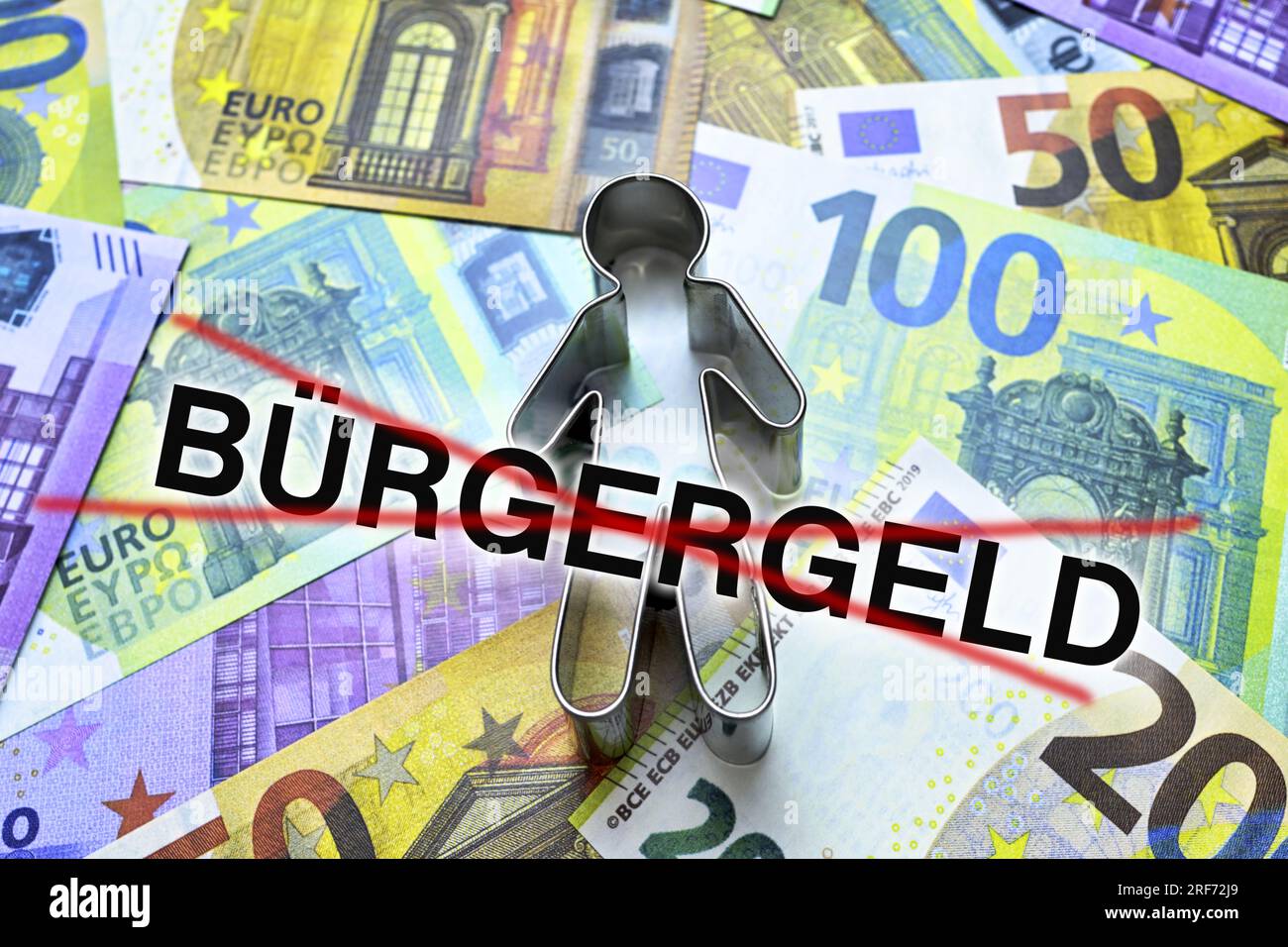 FOTOMONTAGE, Figur auf Geldscheinen mit durchgestrichenem Schriftzug Bürgergeld, Bürgergeld wird von Bundesrat abgelehnt Stock Photo