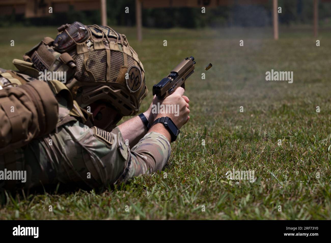 U.S. Army National Guard Sgt. Matthew Marek, a member of the 268th Military Police Command, fires from the prone position during the Tennessee's Adjujant General's pistol competition at VTS Tullahoma, Tennessee on July 28th 2023. The pistol competition involves precision while changing magazines and changing positions in a specific timed sequence. (U.S. Army National Guard photo by Staff Sergeant Ryan S. Gay) Stock Photo