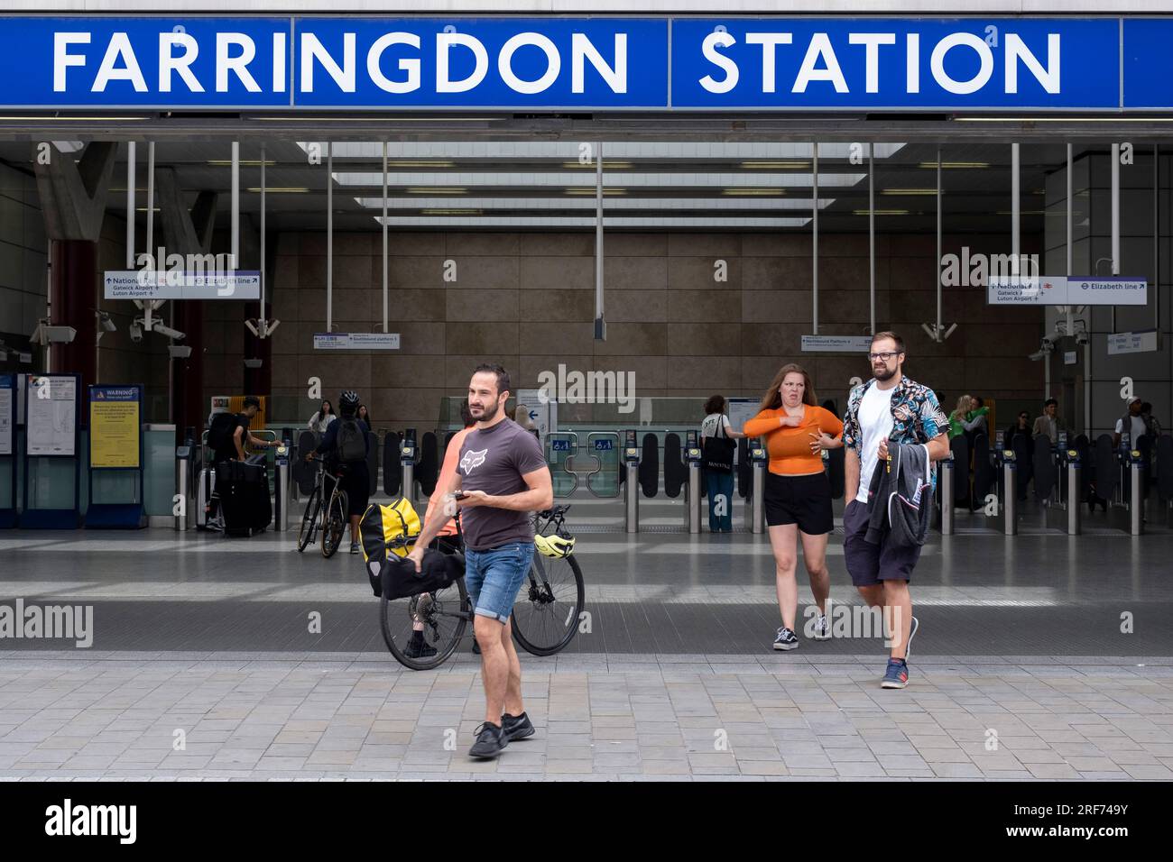 People at the exit / entrance to the new Farringdon London Underground station on 9th July 2023 in London, United Kingdom. The London Underground is a rapid transit system serving Greater London and some parts of the adjacent counties. The Underground has its origins in the Metropolitan Railway, the worlds first underground passenger railway. Stock Photo