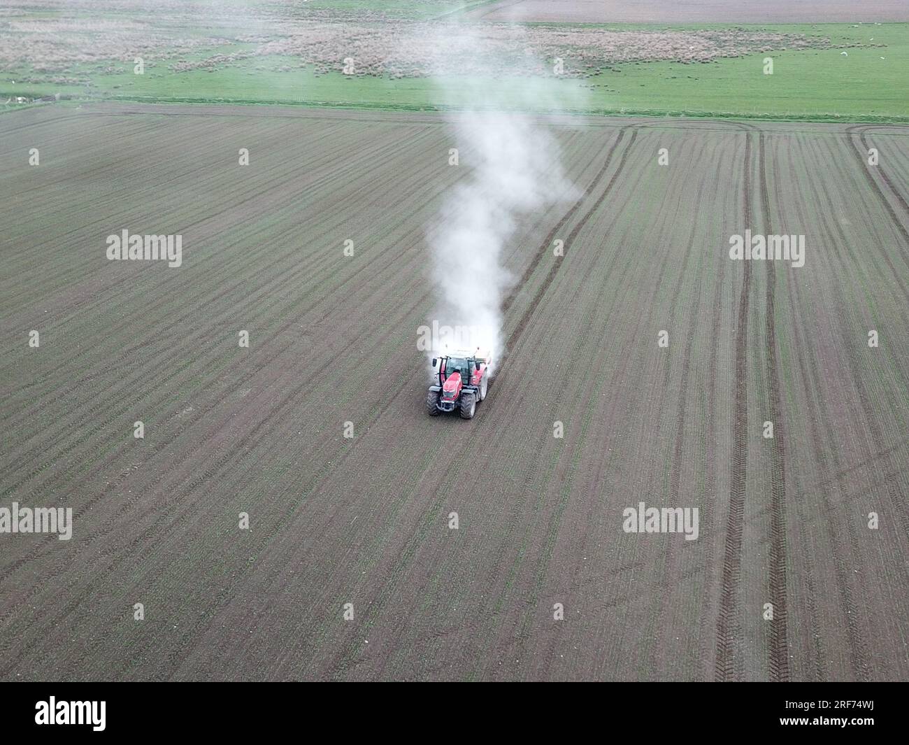 Fertiliser application by tractor Stock Photo