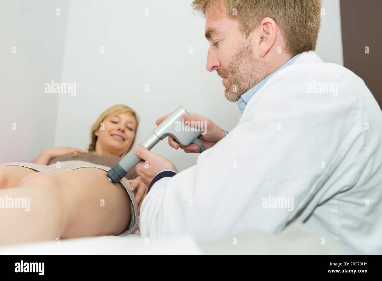 doctor treating the womans vain problem Stock Photo