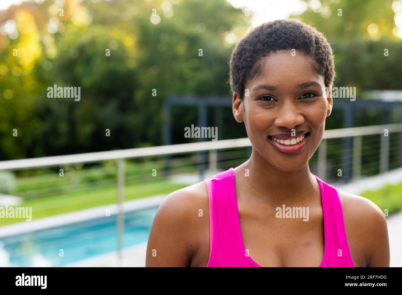 Portrait of happy african american woman on sunny terrace at home, copy ...