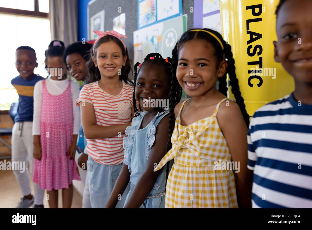 Portrait of happy diverse children in ecology class at elementary school Stock Photo