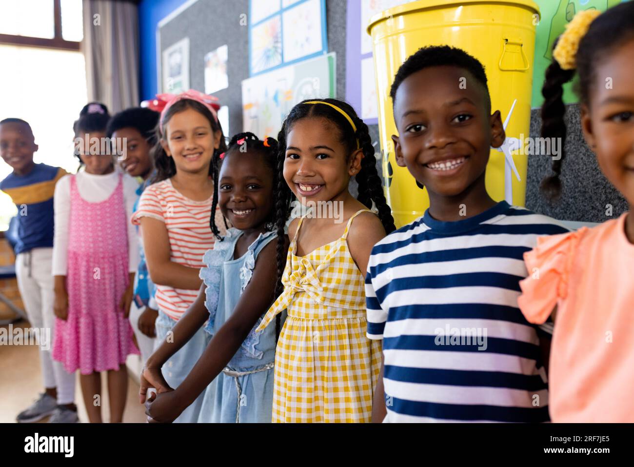 Portrait of happy diverse children in ecology class at elementary school Stock Photo