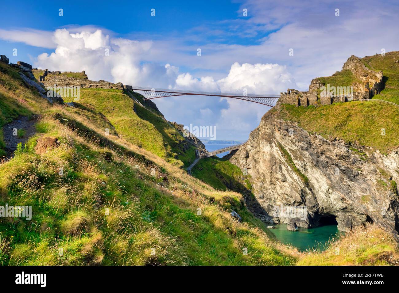 21 June 2023: Tintagel Castle, Cornwall, UK, and its famous double cantilever bridge. It is the legendary birthplace of King Arthur. Merlin's cave... Stock Photo