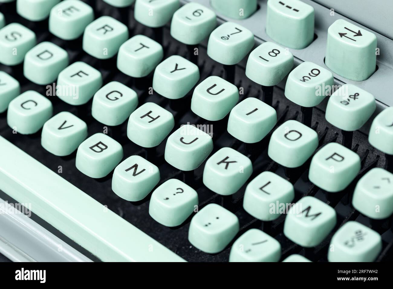 Vintage green typewriter keys background. Selective focus Stock Photo