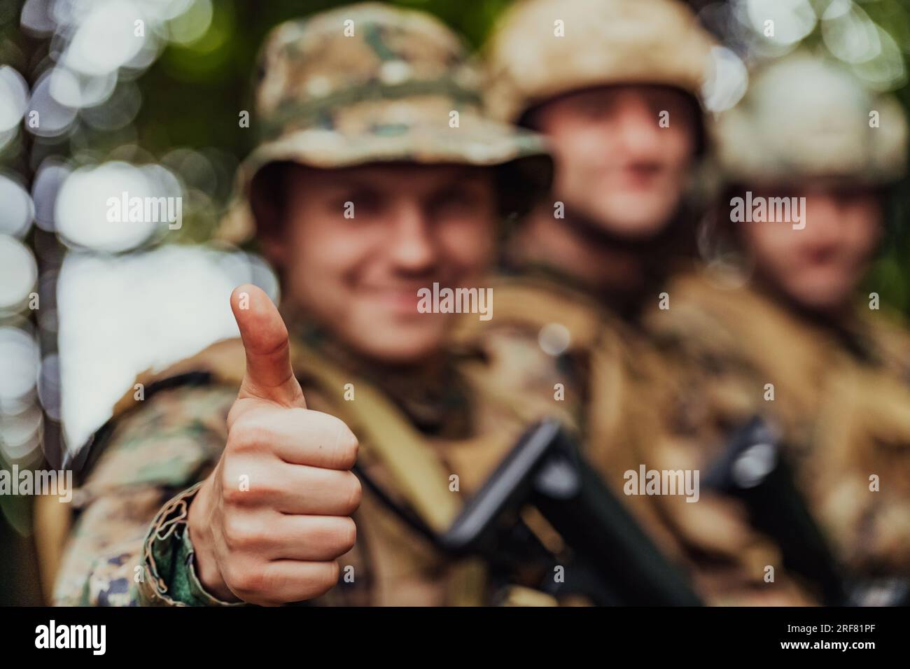 Soldier fighters standing together with guns. Group portrait of US army ...
