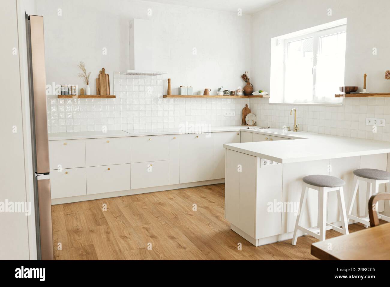 Modern minimal kitchen design. Stylish white kitchen cabinets with ... - Lettered Knobs And Modern Scandinavian Cabinetry