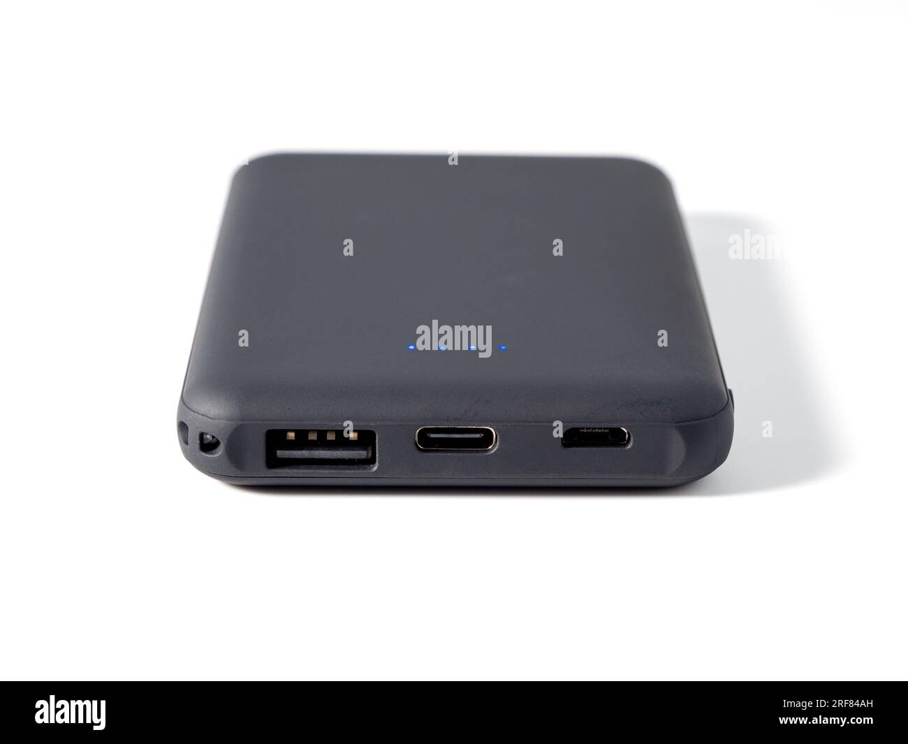 Power bank for charging mobile devices on a white background ...