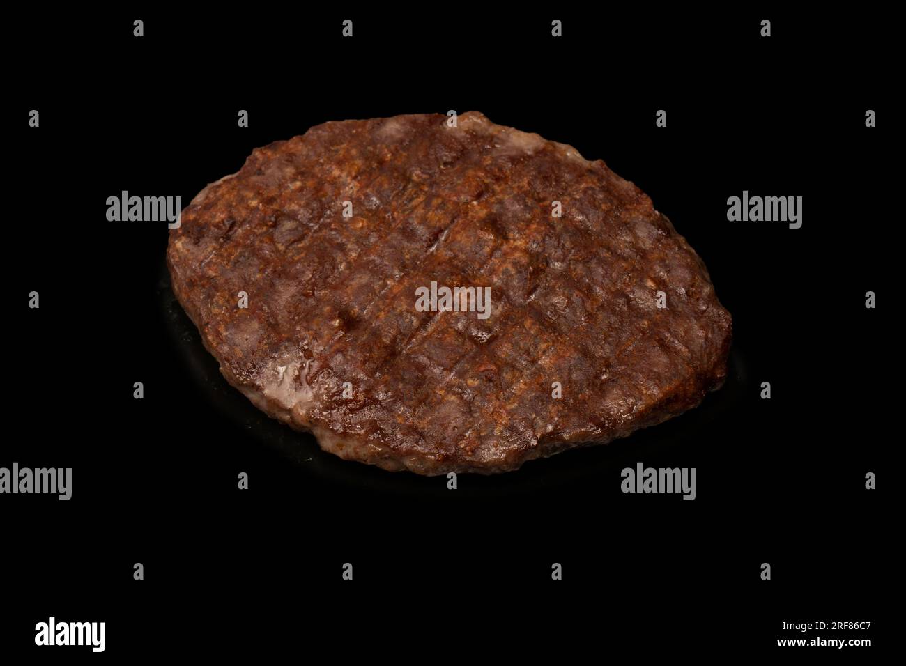 Cutlet with minced beef isolated on a black background. Stock Photo
