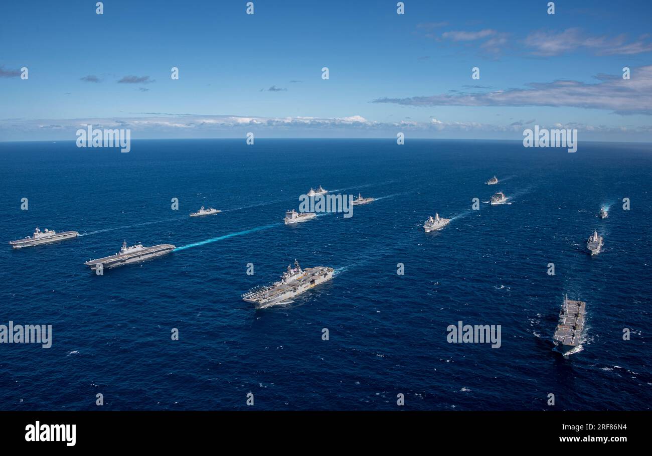 Coral Sea, Australia. 29 July, 2023. The U.S. Navy America-class amphibious assault ship USS America, center right, sails in formation with the Royal Australian Navy Canberra-class landing helicopter dock ship HMAS Adelaide, Japan Maritime Self-Defense Force helicopter destroyer JS Izumo, and the  Korean Navy amphibious assault ship ROKS Marado, during Exercise Talisman Sabre, July 29, 2023 on the Coral Sea. Credit: MC2 Thomas Contant/US Navy Photo/Alamy Live News Stock Photo