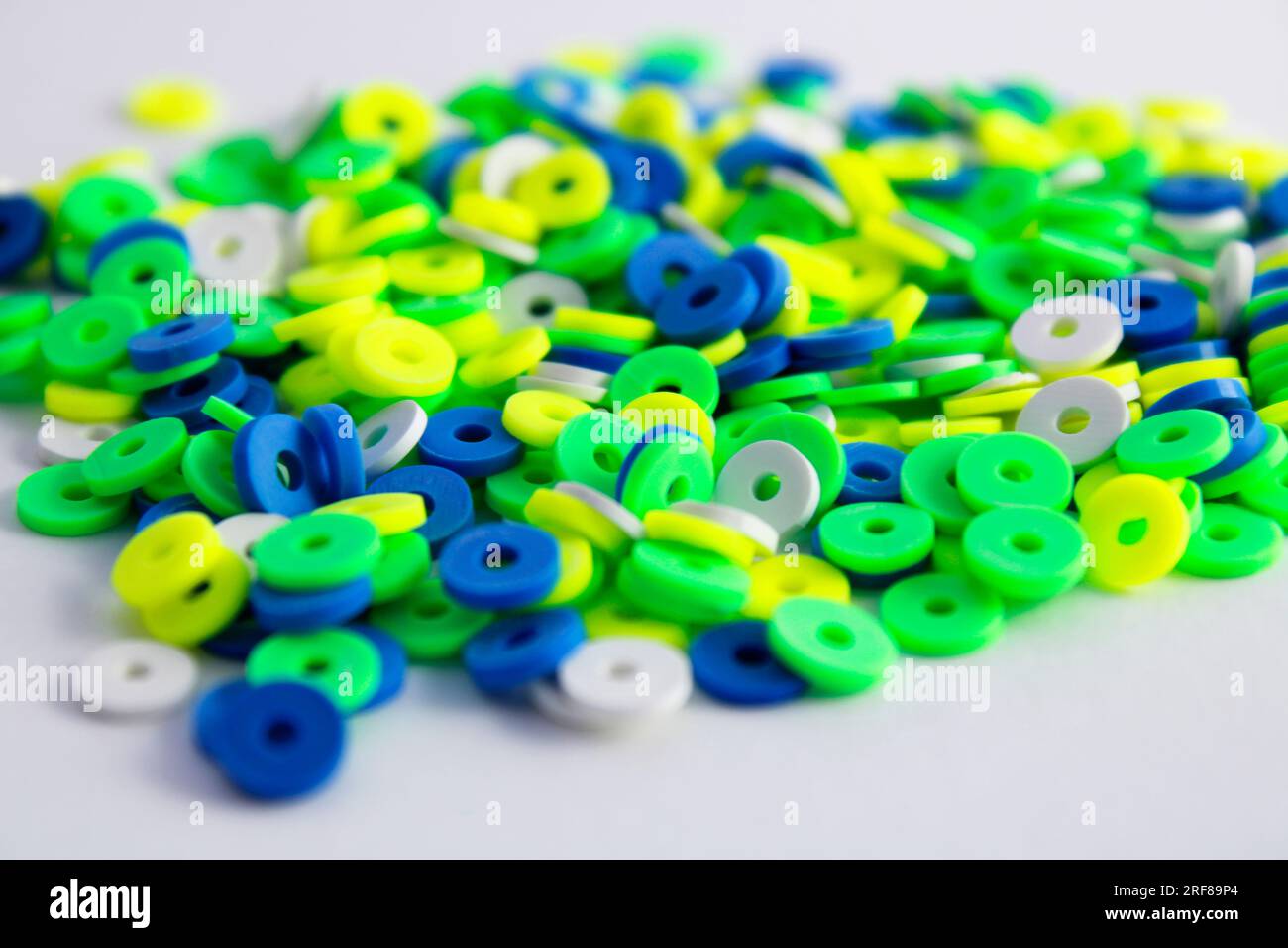 Glass and clay beads of different shapes and colors displayed in bulk at  local fair Stock Photo - Alamy