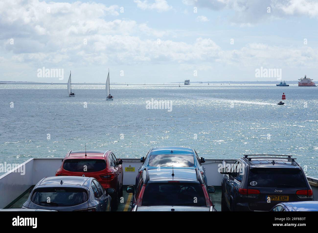 Cowes, IOW, UK. 01 August, 2023. A Red funnel ferry navigates through a