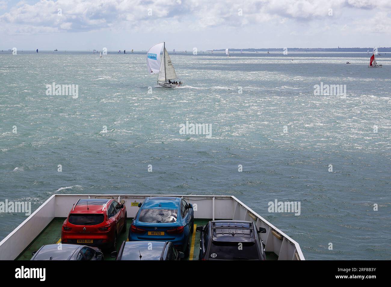 Cowes, IOW, UK. 01 August, 2023. A Red funnel ferry navigates through a