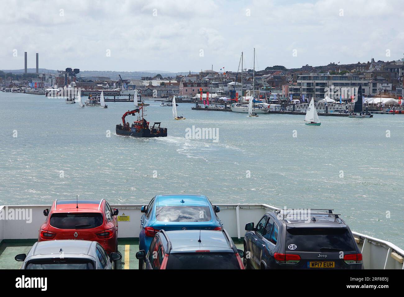 Cowes, IOW, UK. 01 August, 2023. A Red funnel ferry navigates through a