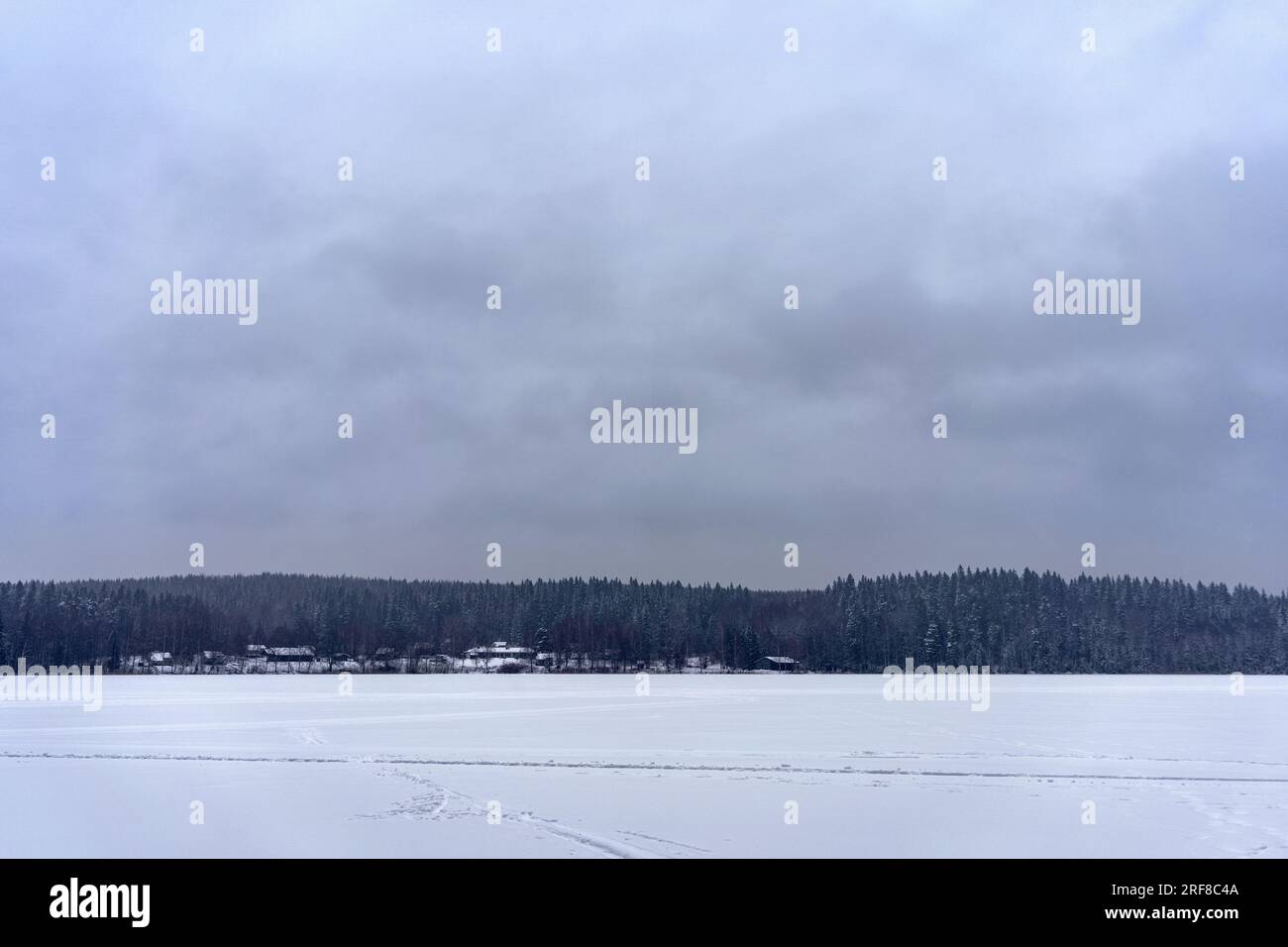 Frozen lake landscape with cloudy sky from Lahti, Finland in winter. Stock Photo