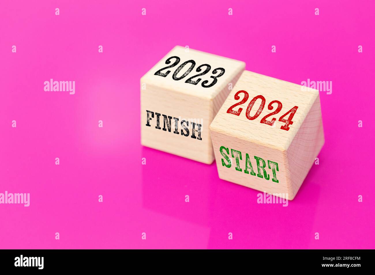 finish 2023 and start 2024, Wooden blocks with text on a beautiful