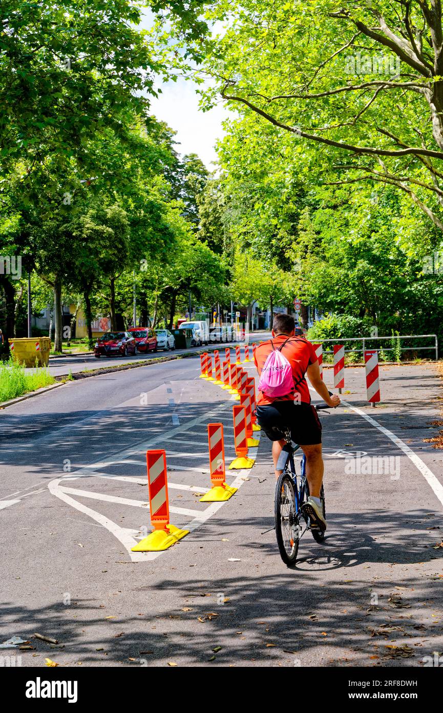 Berlin, Germany - July 30, 2023: Cyclist in a dedicated cycle lane on a ...
