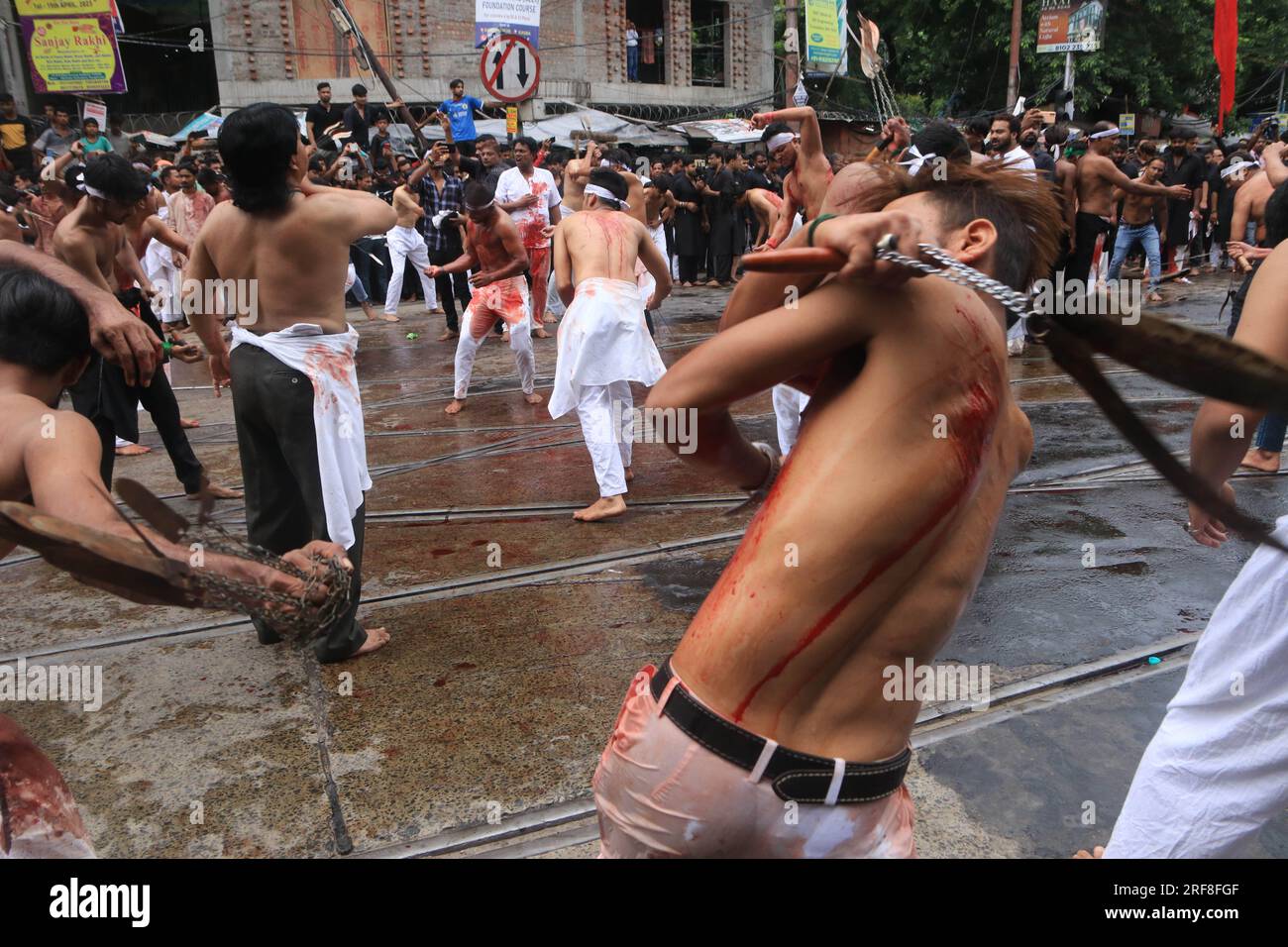 Kolkata, India. 29th July, 2023. **Warning-Graphic Content*** July 29, 2023, Kolkata, India: Shiite Muslim mourners flagellate themselves during a procession on the tenth day of Muharram which marks the day of Ashura. on July 29, 2023 in Kolkata, India. (Photo by Dipa Chakraborty/ Eyepix Group/Sipa USA) Credit: Sipa USA/Alamy Live News Stock Photo