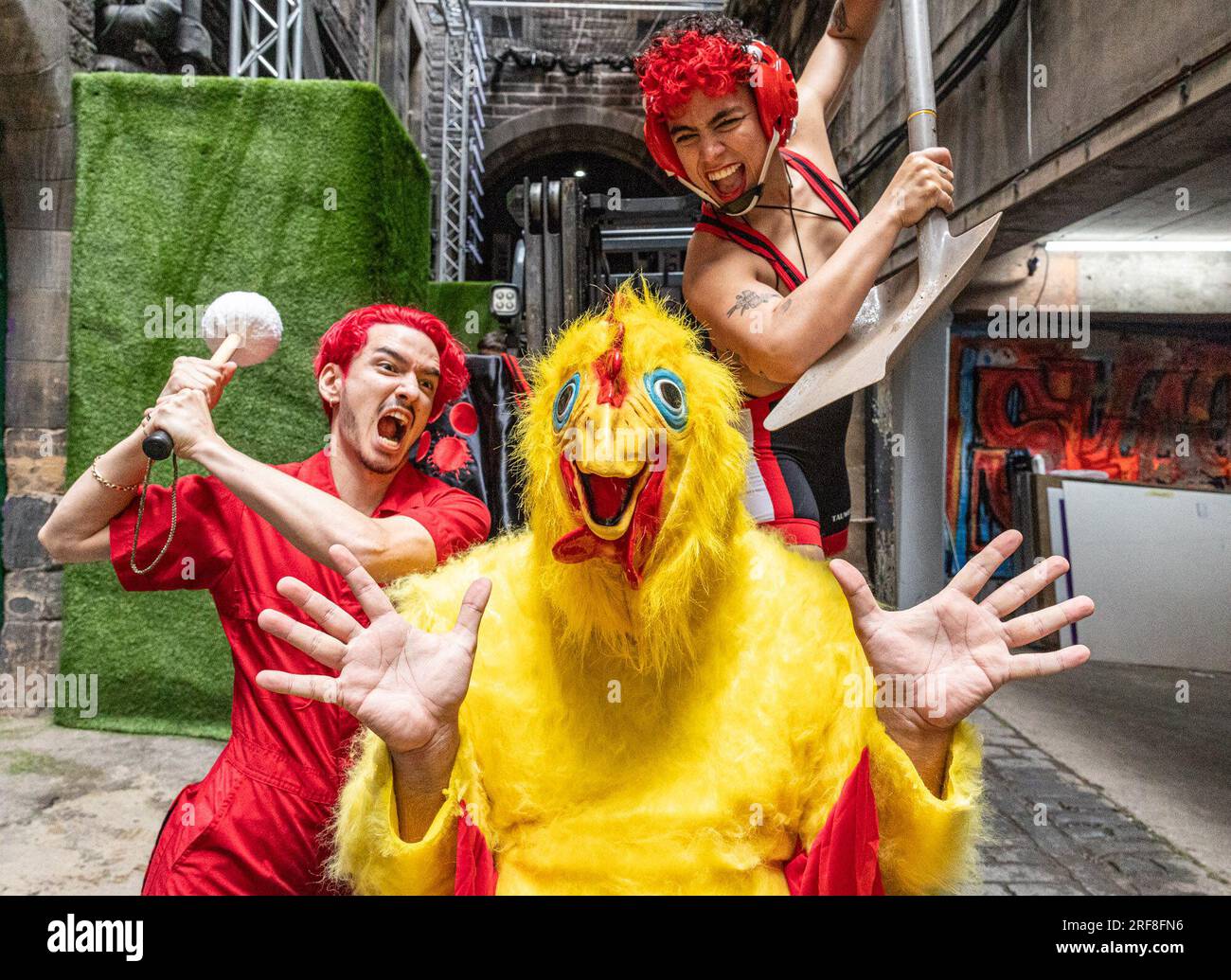 Edinburgh, United Kingdom. 01 August, 2023 Pictured L to R Performers from Batsu help in