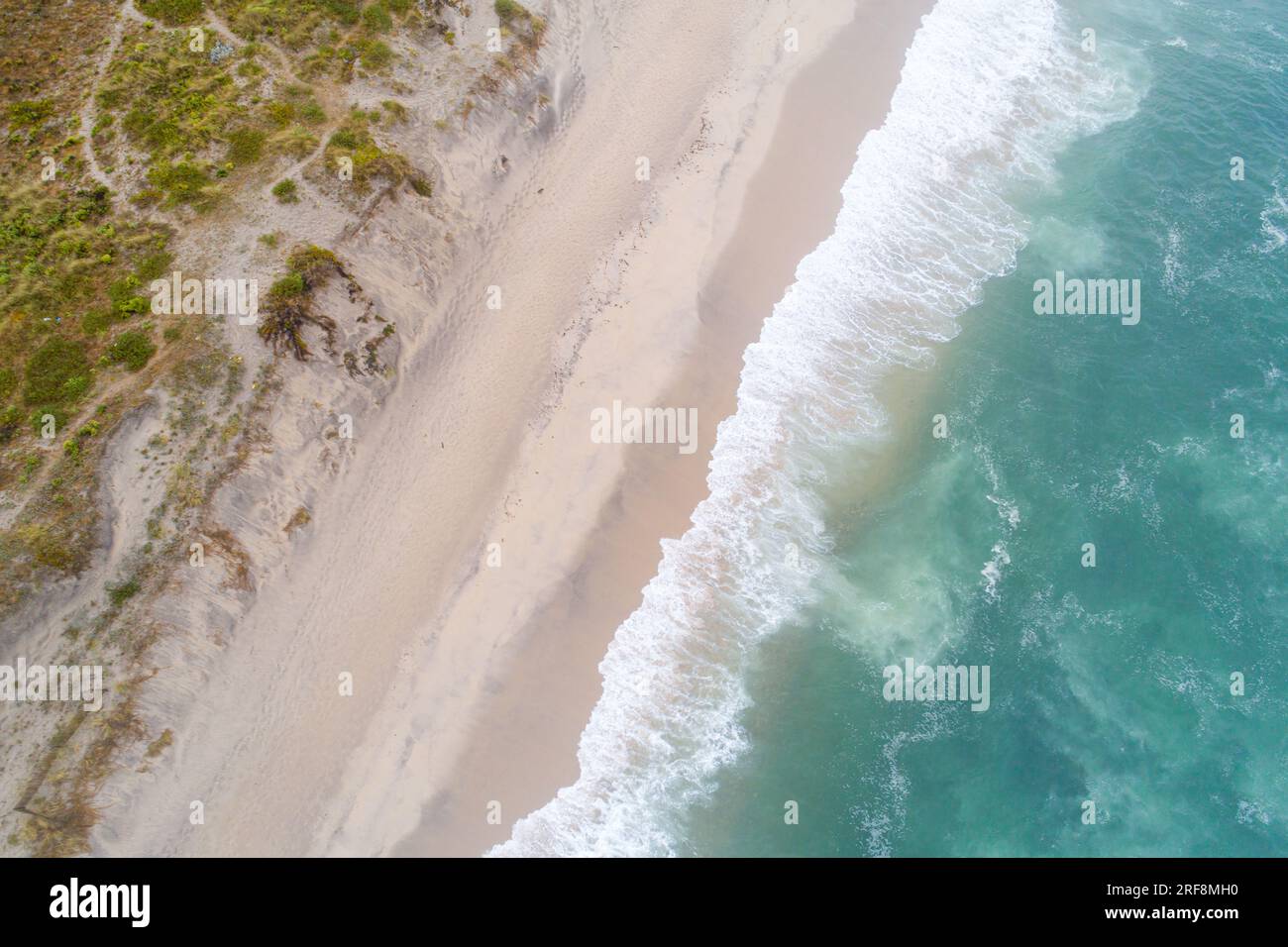 Aerial top view of beautiful tropical white sand beach with wave foam ...