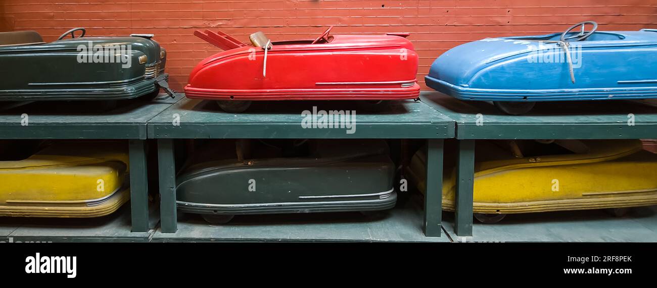 Vintage and old retro amusement park ride colorful cars Stock Photo