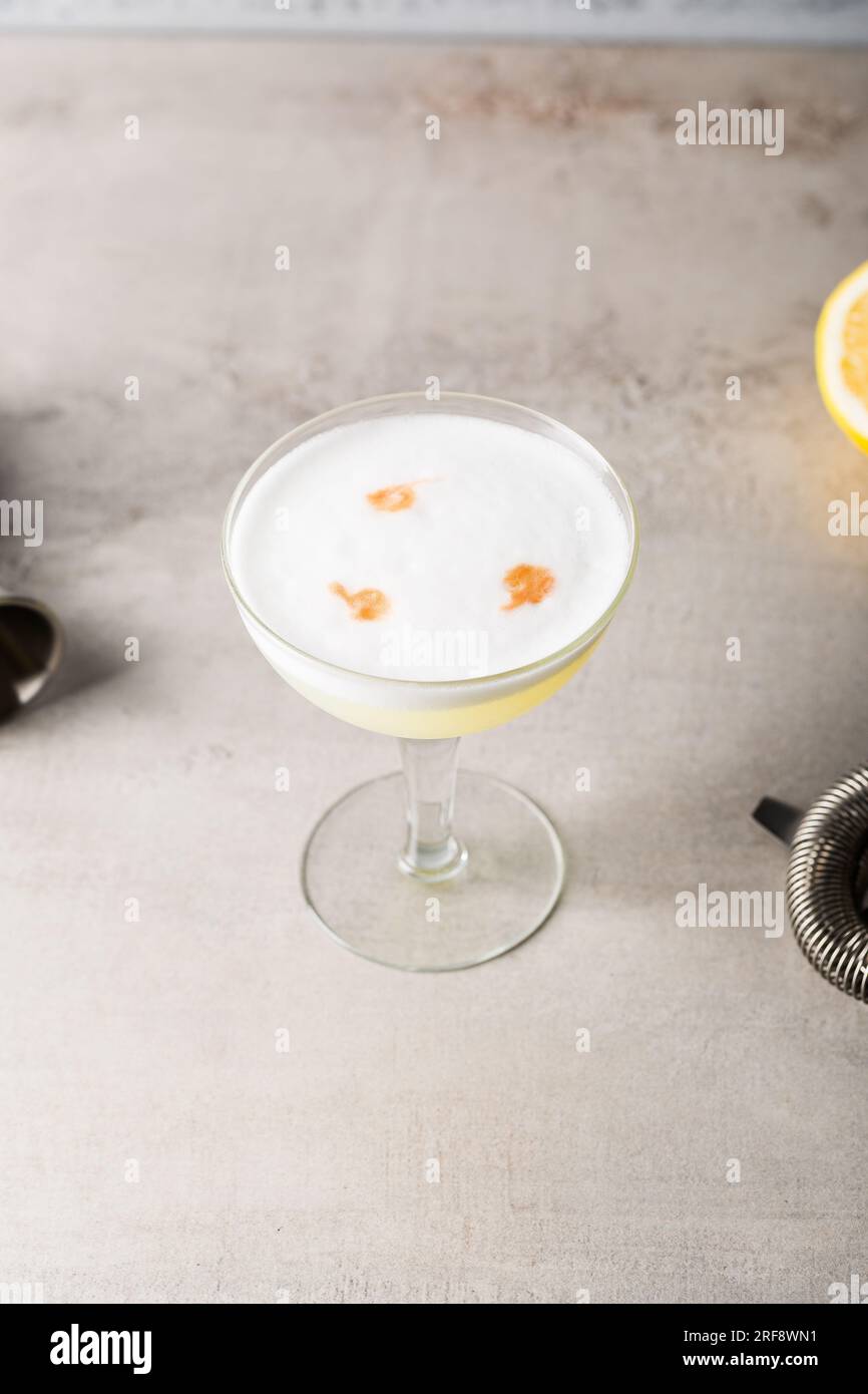 Homemade Pisco Sour Cocktail pisco, fresh lemon juice, syrup, egg white